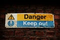 Danger, Keep out sign on a brick wall Royalty Free Stock Photo