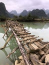 Old dangerous abandonned bamboo bridge crossing a river in the  Trung Khan District, Cao Bang Province, Vietnam Royalty Free Stock Photo
