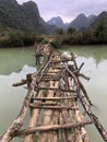 Old dangerous abandonned bamboo bridge crossing a river in the  Trung Khan District, Cao Bang Province, Vietnam Royalty Free Stock Photo