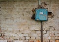 Old bad rusty switch box on weathered wall