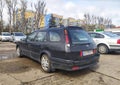 Old dark blue car Toyota Corolla hatchback medium left side and rear compartment view Royalty Free Stock Photo