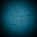 Old dark blue wall in spots, cracks, stains. Painted concrete wall in abstract grunge style. Grunge loft background texture for ba Royalty Free Stock Photo