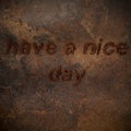 Old dark brown grunge background. Coffee beans Have a nice day inscription. Fresh morning and healthy breakfast.