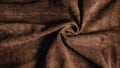 Dark brown suede leather texture background.