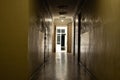 An old dark corridor is long in an office building in the city center in Ukraine, a door to the corridor, an exit, a Royalty Free Stock Photo