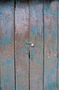 Old dark cyan wooden closed door of a traditional house in Asia