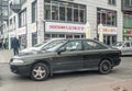 Old dark green sedan car Mitsubishi Carisma parked Royalty Free Stock Photo