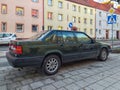 Old classic veteran grunge big heavy dark green Swedish Volvo 940 or Polar sedan car parked Royalty Free Stock Photo