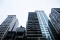 Old dark grey high-rises office and residential buildings in Hong Kong