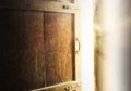 Old dark room with shining closed door. Royalty Free Stock Photo