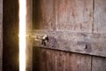 Old dark room with shining closed door. Royalty Free Stock Photo