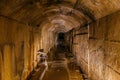 Old dark vaulted underground flooded sewer tunnel