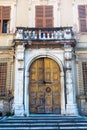 Old decayed house door in Lucca