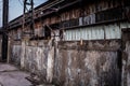 Old decaying wall in front of abandoned factory Royalty Free Stock Photo
