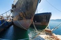 Old, decommissioned cargo boats side by side Royalty Free Stock Photo