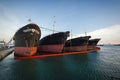 Old, decommissioned cargo ships in a row Royalty Free Stock Photo