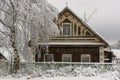 Old decorated traditional wooden house in Russian city in winter Royalty Free Stock Photo