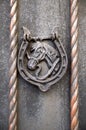 Old decorative door knocker with shape of horse head on wooden door , Bulgaria Royalty Free Stock Photo