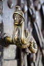 Old decorative handle, close up,at a medieval door