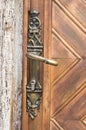 Old decorative handle and secret lock on wooden door , Bulgaria Royalty Free Stock Photo