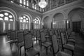 Old decorative interior of architectural monument Chandelier and chairs
