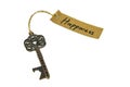 Old decorative key and handwritten tag \