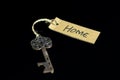 Old decorative key and handwritten tag \