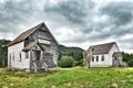 Old decrepit buildings in the country with dramatic sky