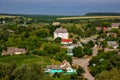 The old defensive church and the remains of the castle ruins. Landscape with a church on a summer day in the village of Sutkivtsi