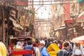 Old Delhi, India, Mar 29 2019 - Overcrowded street in old town with smog, dangerous electric lines close Jama masjid