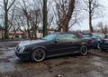 Black old classic vintage veteran rusty coupe convertivle car Mercedes Benz CLK parked