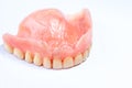 Old denture on a white background