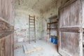 Old depository room with wooden portal in old country house