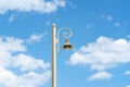 Old design Street light against blue sky background. Royalty Free Stock Photo