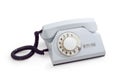 Old telephone set with rotary dial in white plastic housing Royalty Free Stock Photo