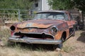 Old Desoto Firedome Entry Level Series 1956 abandoned and rusting in the courtyard