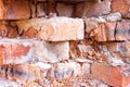 Red brick destroyed wall background. Old destroyed bricks, background and texture Royalty Free Stock Photo