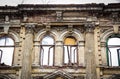 Old destroyed building. Beautiful old windows in ruined mansion. Destruction building. Royalty Free Stock Photo