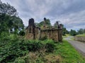 Old destroyed building on the side of a countryside road Royalty Free Stock Photo