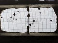 Old, destroyed concrete block ceiling with only rusty metal grid left Royalty Free Stock Photo