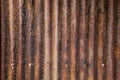 Old detailed aged vintage rusty corrugated red brown textured zinc metal sheet exterior fence used in construction industry Royalty Free Stock Photo