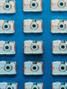 Old digital camera pattern on blue Royalty Free Stock Photo