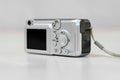 Old digital camera. The small camera is silver Royalty Free Stock Photo