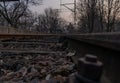 Old, dilapidated and abandoned railway station with rusty railway tracks and wooden railway sleepers Royalty Free Stock Photo
