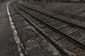 Old, dilapidated and abandoned railway station with rusty railway tracks and wooden railway sleepers Royalty Free Stock Photo