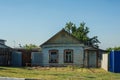 Old dilapidated abandoned small wooden house with gate Royalty Free Stock Photo