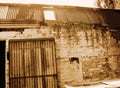 OLD DILAPIDATED BRICK BUILDING IN SEPIA Royalty Free Stock Photo