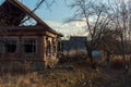 Old dilapidated burned-out country house at sunset Royalty Free Stock Photo