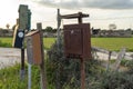 Old and dilapidated mailboxes in a rural area Royalty Free Stock Photo