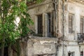 Old Dilapidated Neoclassical Two Floor House in Patras City Downtown. Abandoned Residence with Big Windows, Yard and a Balcony